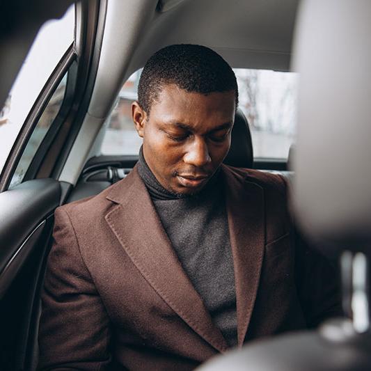 business man in back of car